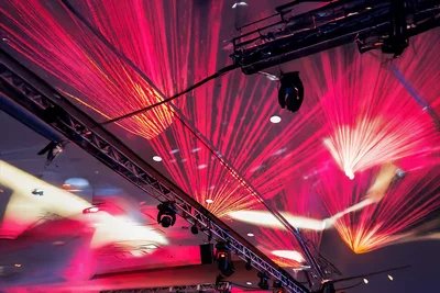 Event production crew setting up staging and AV for corporate gala